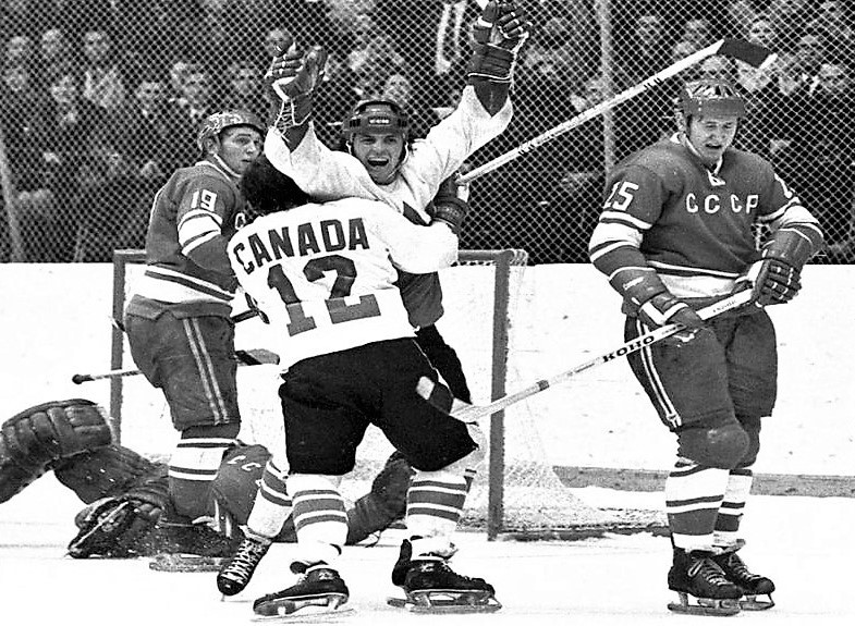 Paul Henderson admires Team Canada sweater after he was named