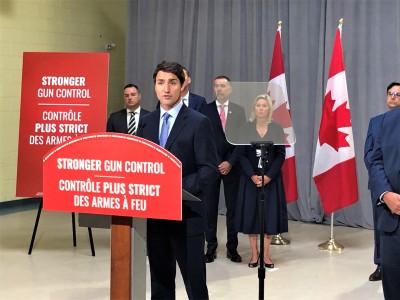 With Crombie sitting behind him Trudeau pledges $250-million to directly help cities combat gang-related violence